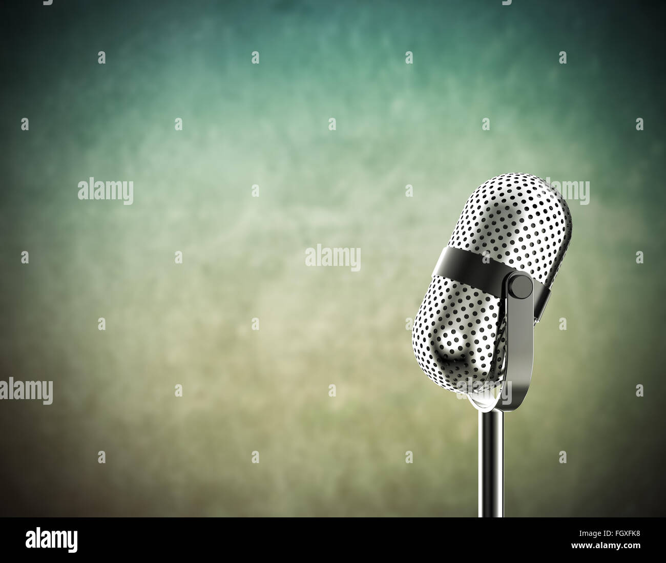 Vintage microphone isolated on a green background Stock Photo