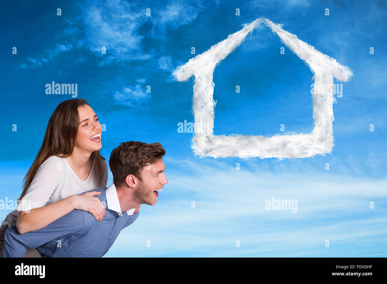 Composite image of smiling young man carrying woman Stock Photo