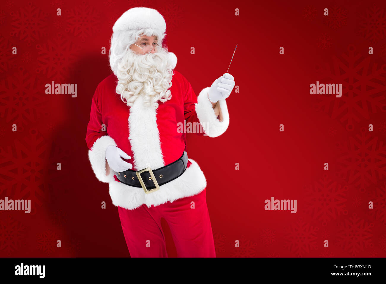 Composite image of portrait of santa claus holding Stock Photo - Alamy