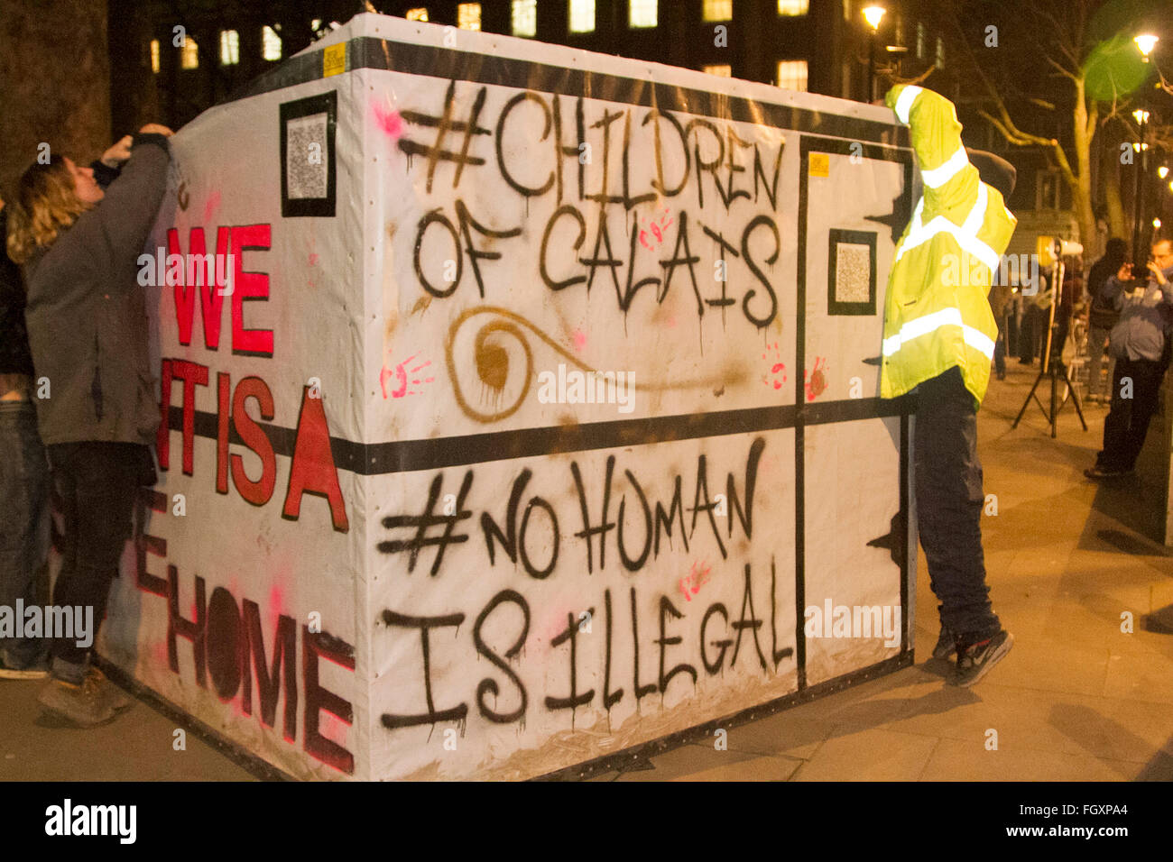 London UK. 22nd February 2016. Protesters rally outside Downing street in London to demand the British government to allow refugees to be allowed to enter Britain and also against the French decision to clear the so called Jungle refugee camp in Calais Credit:  amer ghazzal/Alamy Live News Stock Photo