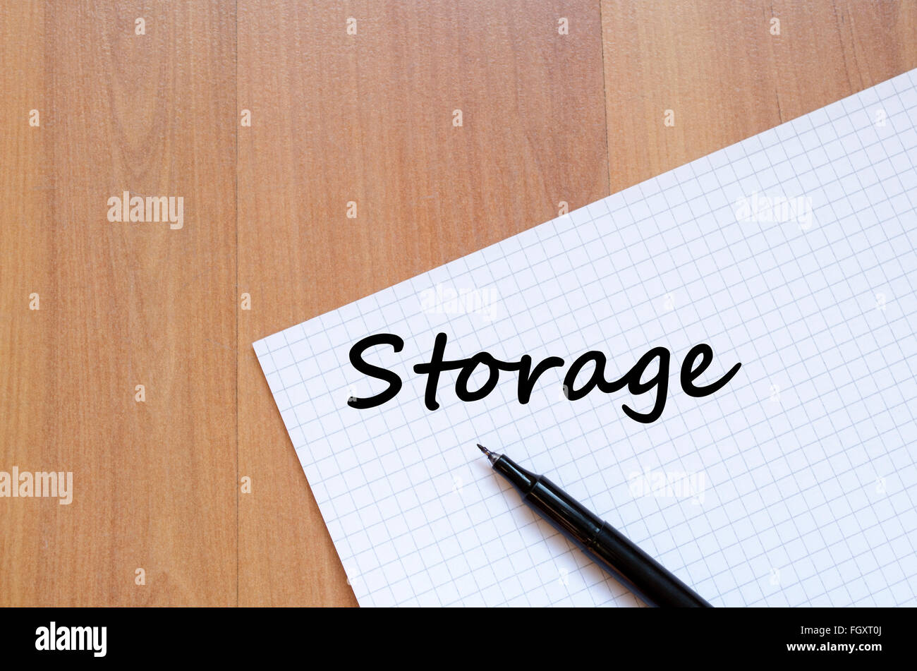 Storage text concept write on notebook with pen Stock Photo - Alamy