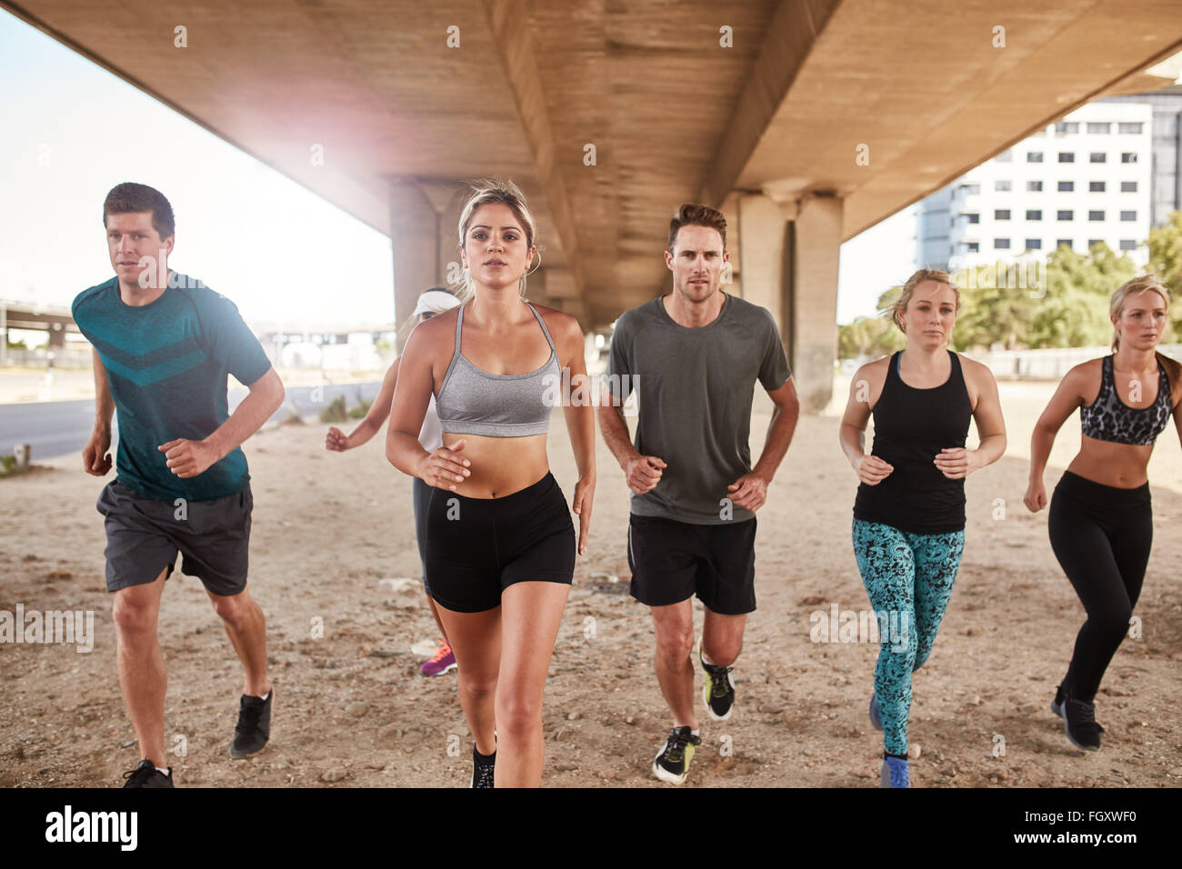 Determined group of athletes running. Runners in sportswear training