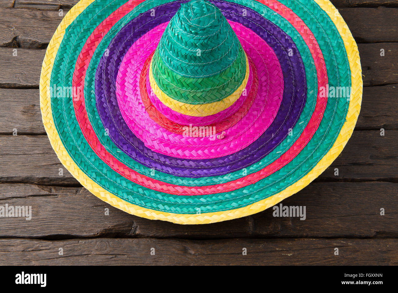 Mexican sombrero on old dark wood background Stock Photo - Alamy