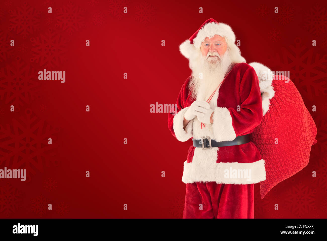 Composite image of santa carries his red bag Stock Photo - Alamy
