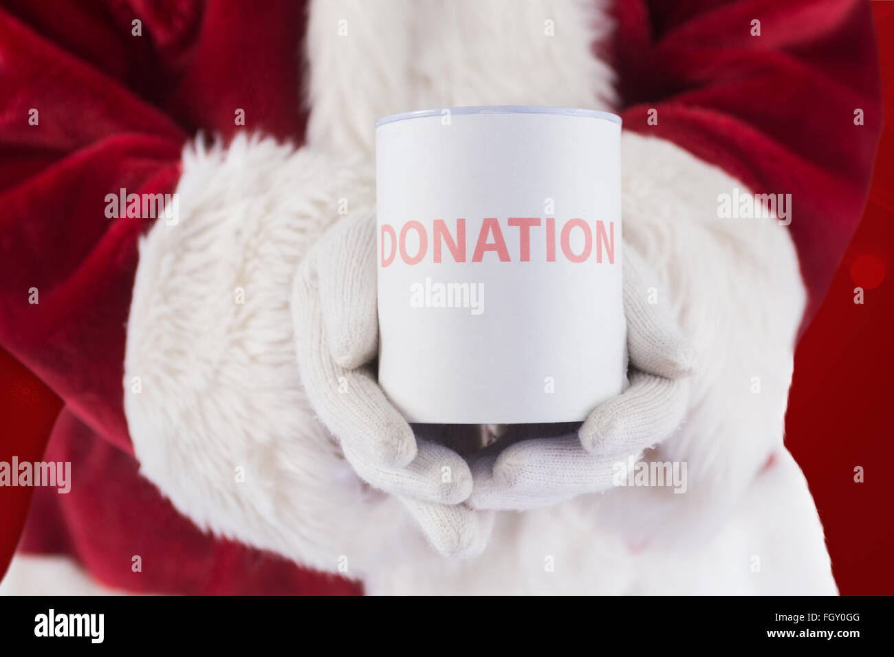 Composite image of santa holds a can for donations Stock Photo