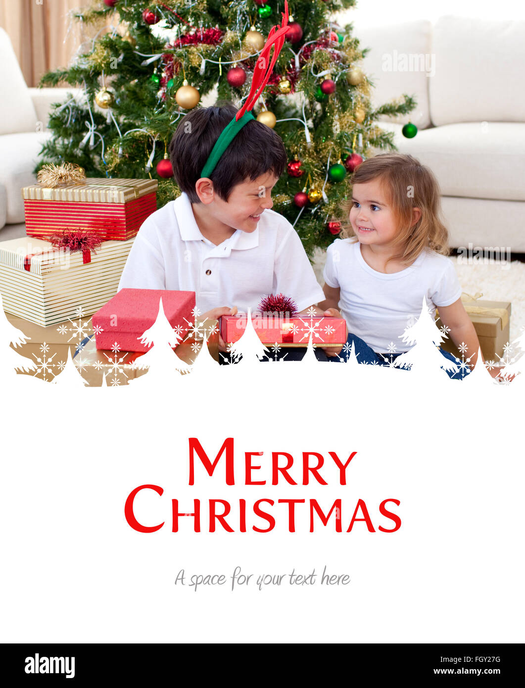 Composite image of happy brother and sister celebrating christmas Stock Photo
