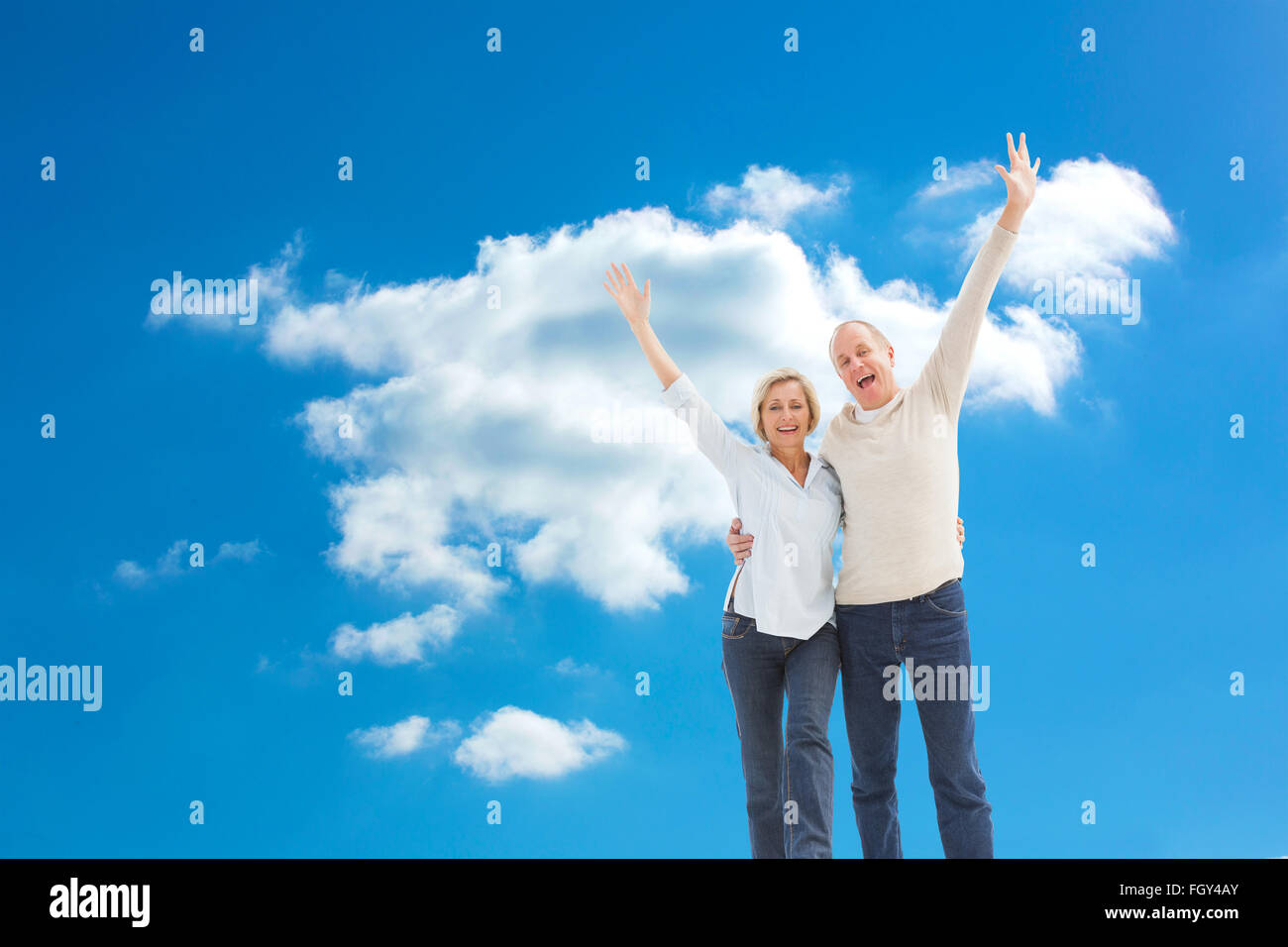 Composite image of happy mature couple cheering at camera Stock Photo ...