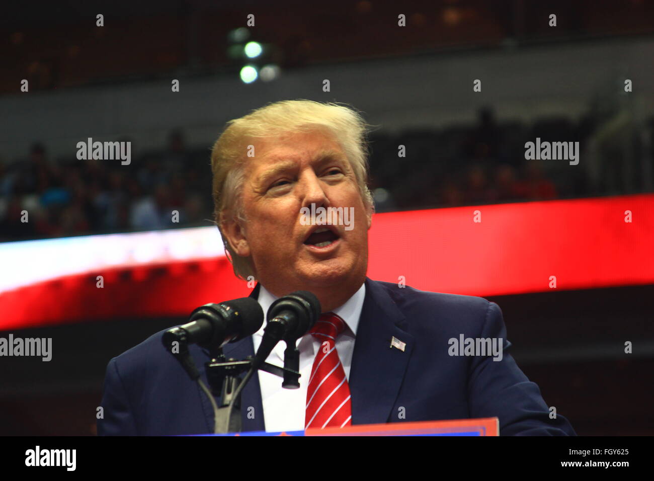 Donald John Trump, an American real estate developer, television personality, business author and GOP political candidate,  addresses supporters at a rally at the American Airlines Center in Dallas. Stock Photo
