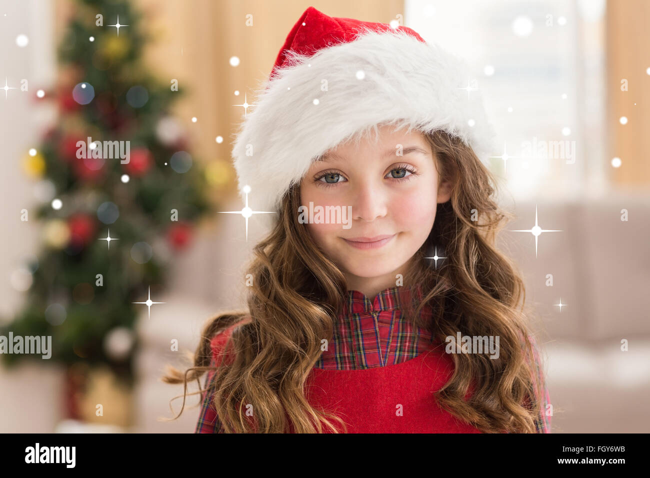 Composite image of festive little girl smiling at camera Stock Photo ...