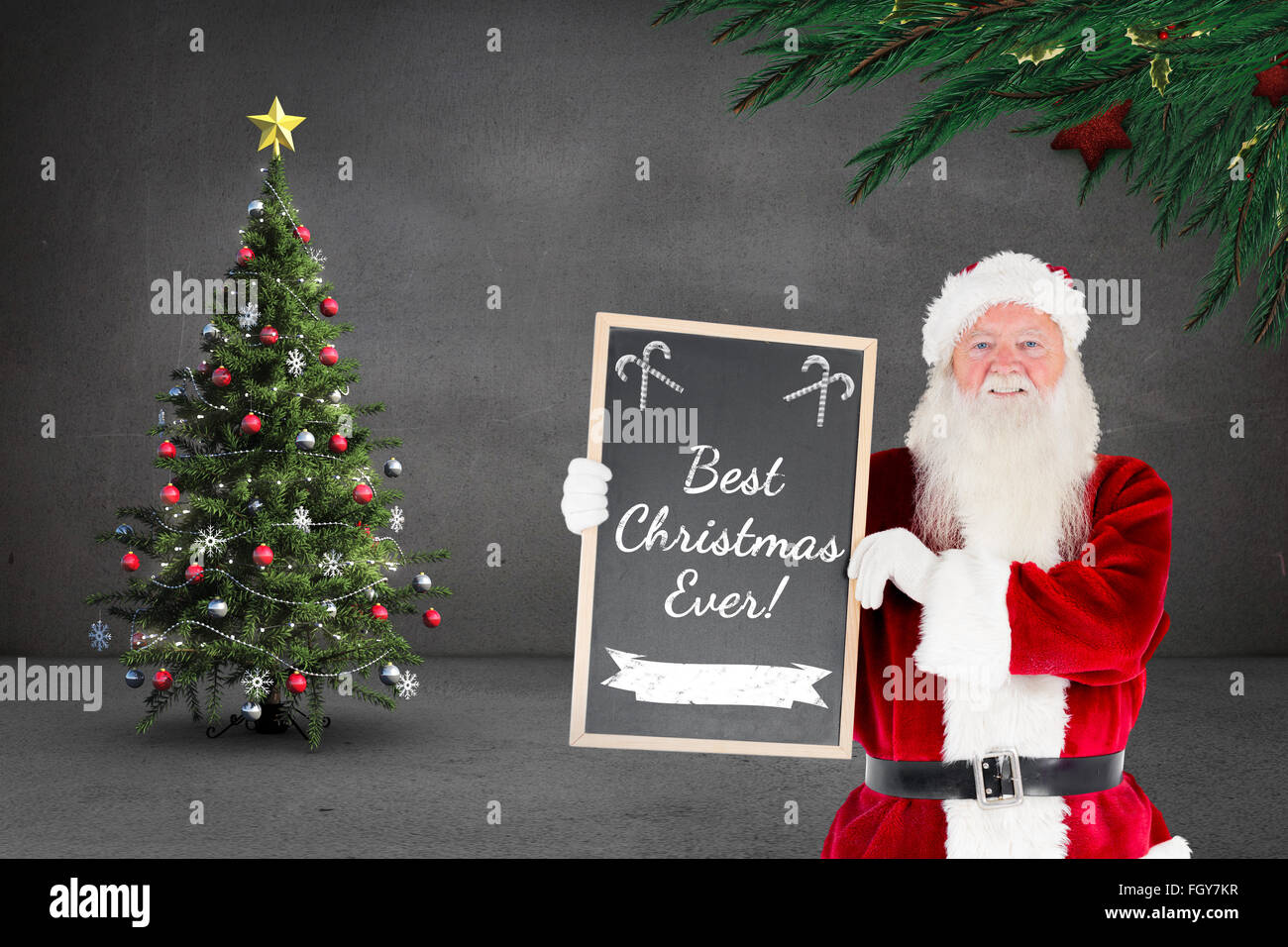Composite image of santa claus showing blackboard Stock Photo - Alamy