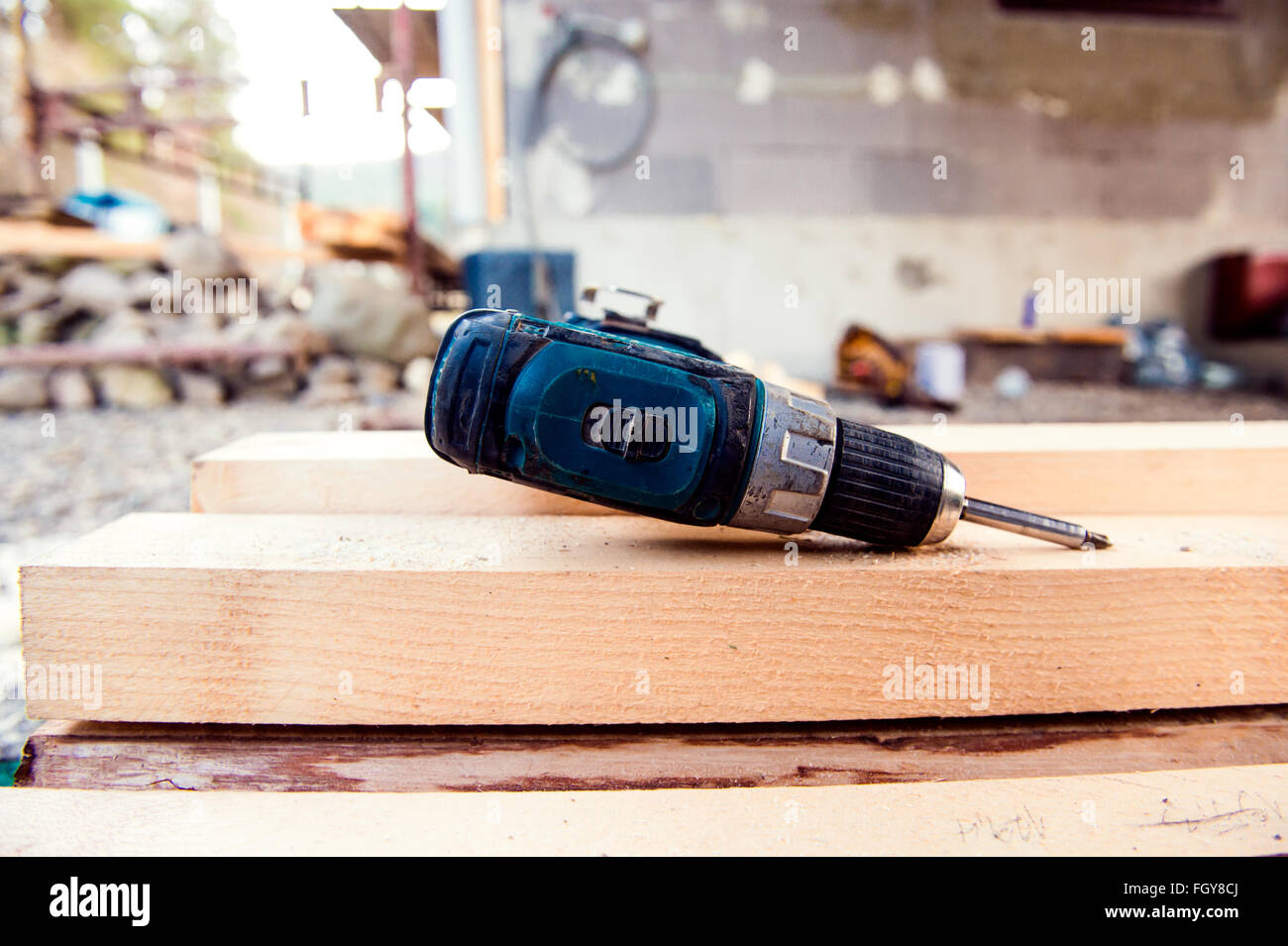 Detail of drill laying on wooden beams on site Stock Photo Alamy