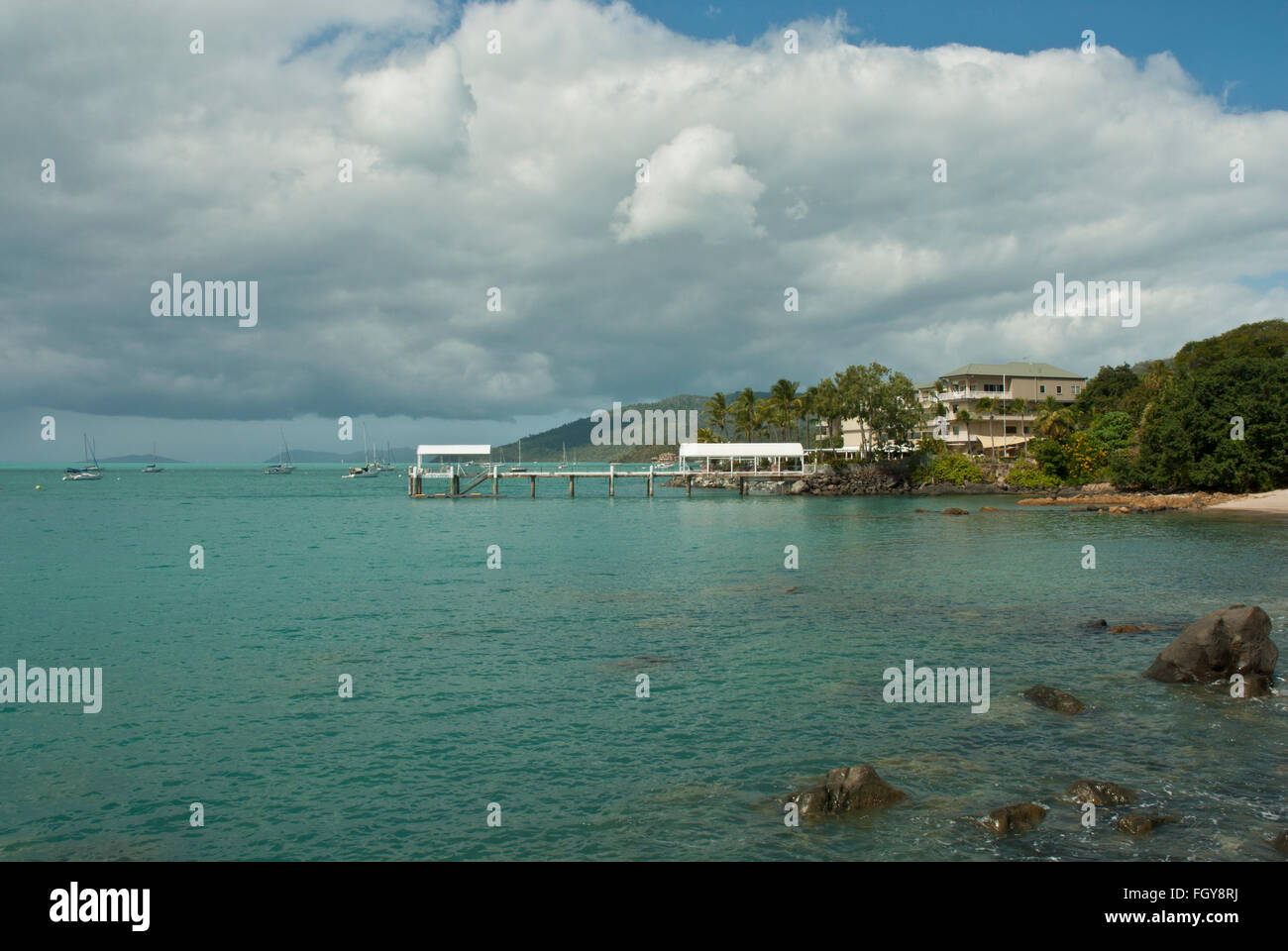 View of jetty and hotel near Airlie  and Whitehaven Beach Stock Photo