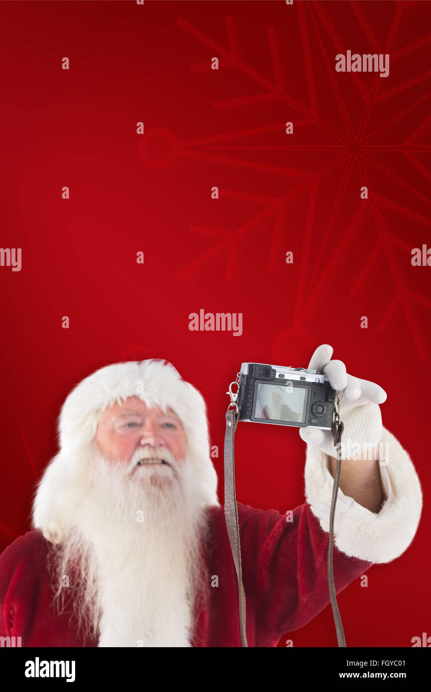 Composite image of santa claus makes a selfie Stock Photo - Alamy