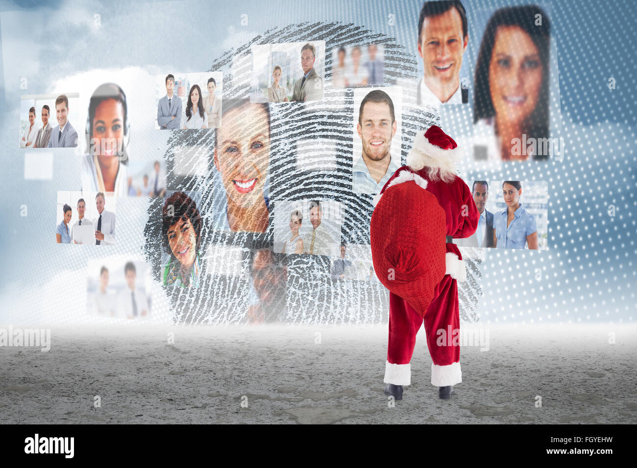 Composite image of santa carrying sack of gifts Stock Photo - Alamy