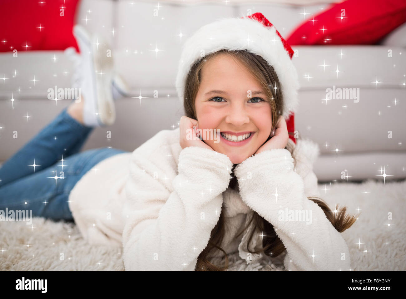 Composite image of festive little girl smiling at camera Stock Photo ...