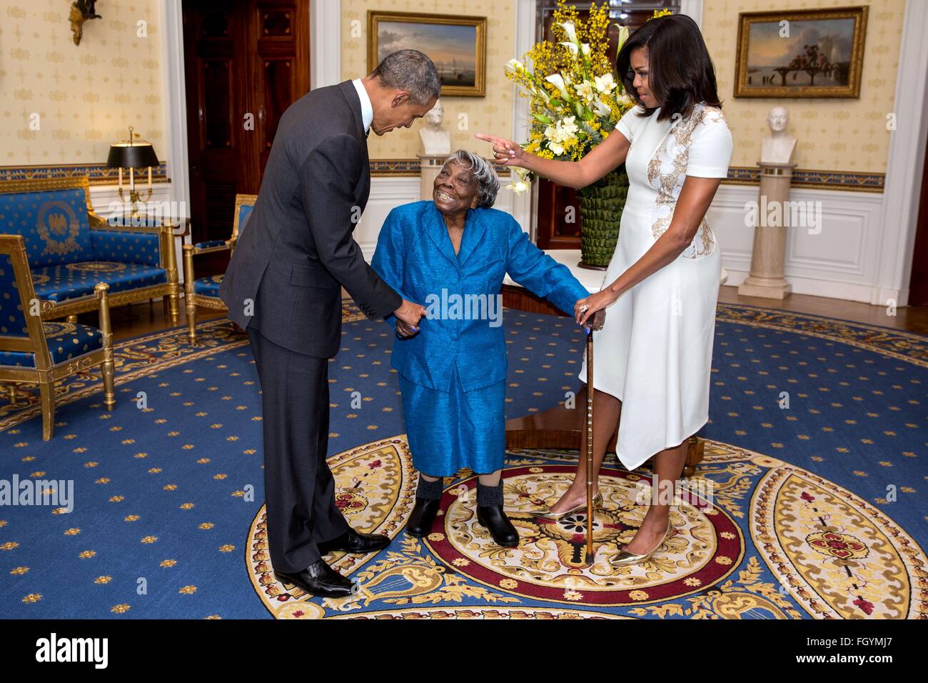 U.S. President Barack Obama and First Lady Michelle Obama greet 106-Year-Old Virginia McLaurin in the Blue Room of the White House prior to a reception celebrating African American History Month February 18, 2016 in Washington, DC. Stock Photo