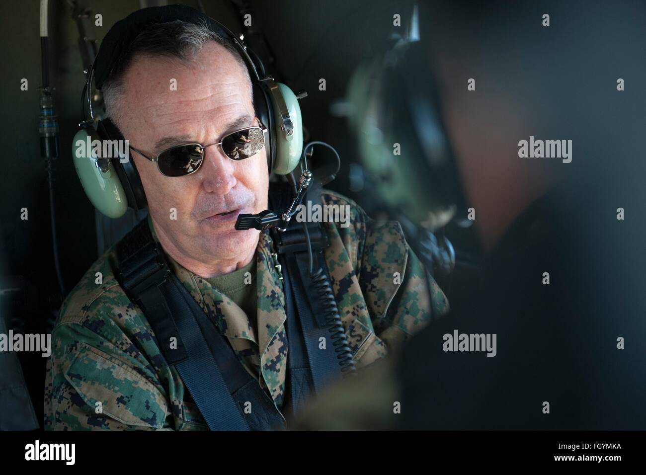 U.S Joint Chiefs Chairman General Joseph F. Dunford Jr. aboard a UH-60 Black Hawk helicopter February 9, 2016 in Honolulu, Hawaii. Stock Photo