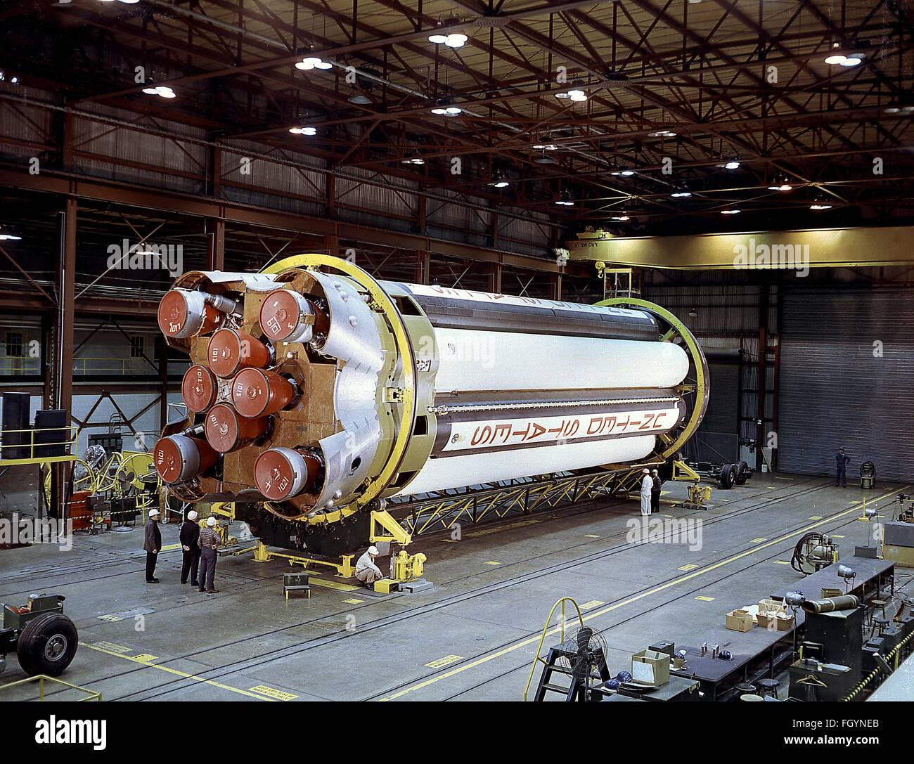 The Saturn I S-I stage rocket is inspected for checkout in Building 4705 rocket at the Marshall Space Flight Center  January 18, 1961 in Huntsville, Alabama. The Saturn I S-I stage has eight H-1 engines clusters, using liquid oxygen/kerosene-1 propellants capable of producing a total of 1,500,000 pounds of thrust. Stock Photo