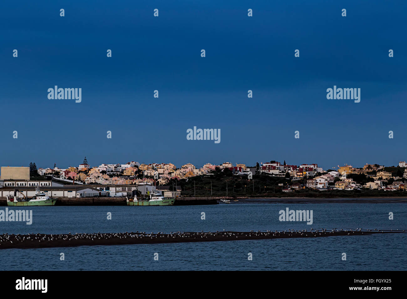 Portimao town and harbour at night, Algarve, Portugal Stock Photo