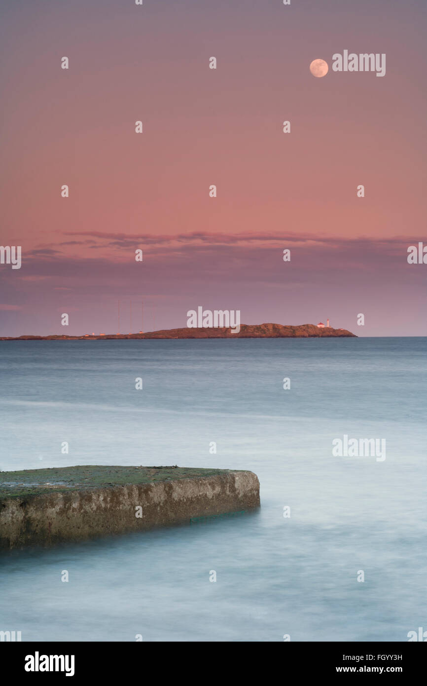 Trial island with the moon rising over it. Stock Photo