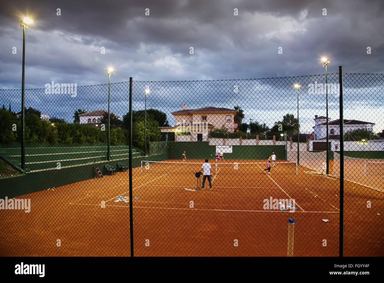 Tennis lesson Tennis Club Mijas, Malaga province Costa del Sol. Andalusia,  southern Spain Stock Photo - Alamy