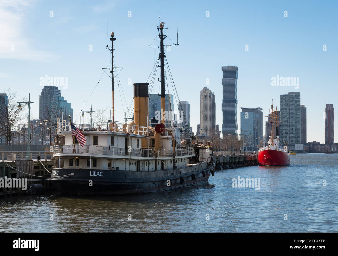 Lilac steam boat docked at Pier 25 in Tribeca on the Hudson River, New York, is an old lighthouse tender ship. Stock Photo
