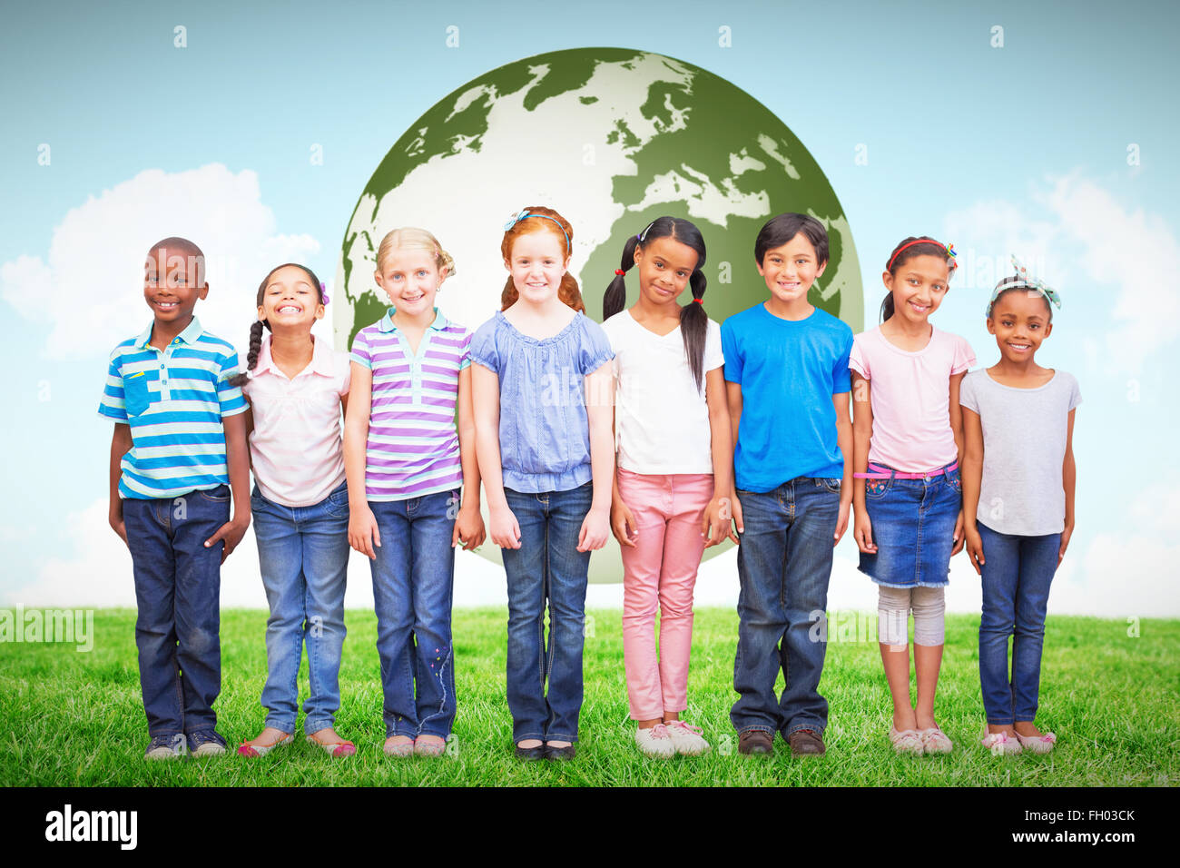 Composite image of cute pupils smiling at camera in classroom Stock ...