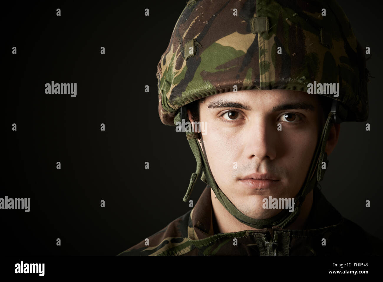 Studio Portrait Of Soldier In Uniform Stock Photo