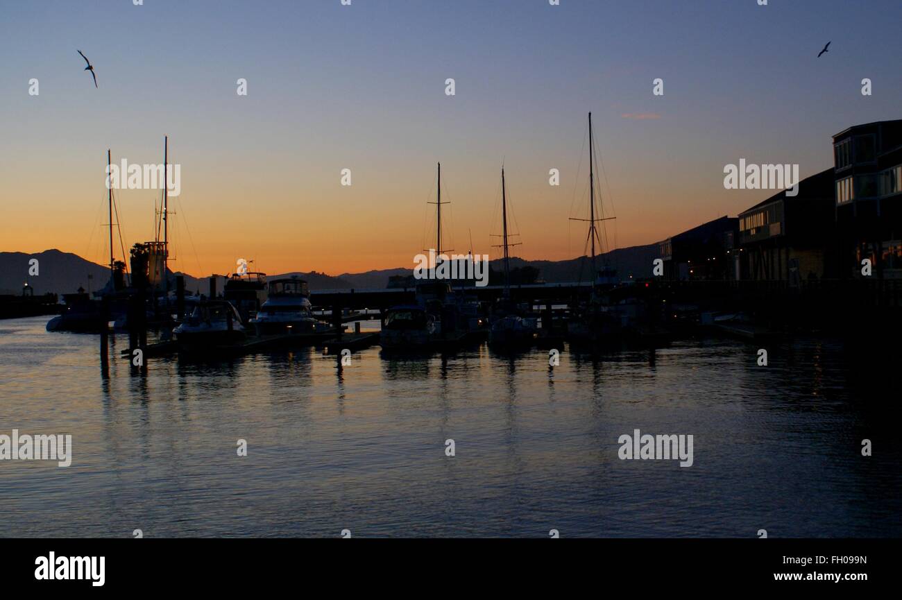Sunset view of San Jose city and Bay with orange skyline, view from Sikh Gurdwara atop hill Stock Photo