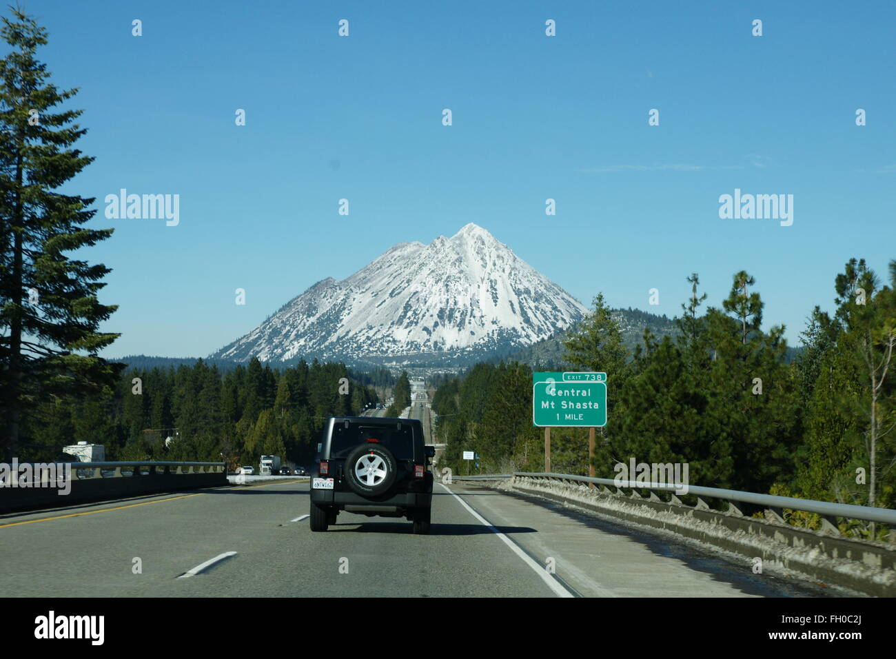 Road leading to Mount Shasta, California, USA, beautiful tall snow covered mountain, a famous tourist destination, volcanic Stock Photo