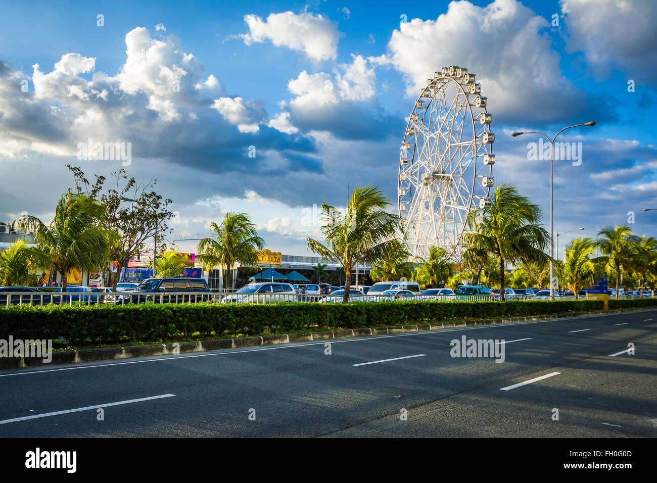 Ferris wheel and Seaside Boulevard, in Pasay, Metro Manila, The Philippines Stock Photo Alamy