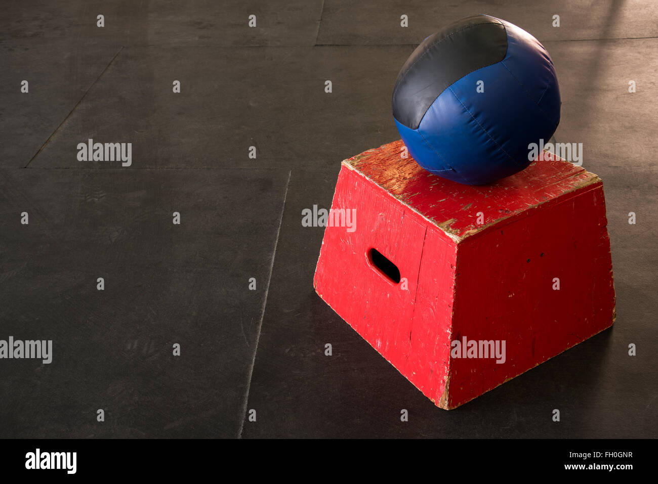 Red jump box with a navy and black medicine ball Stock Photo Alamy