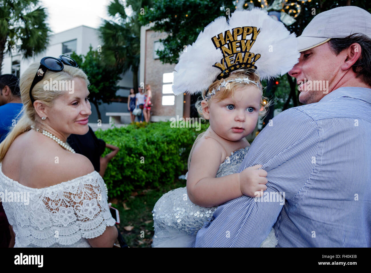 Miami Beach Florida,Ocean Drive,New Year's Eve,family families parent parents child children,mother father,girl girls,youngster,female kids children d Stock Photo