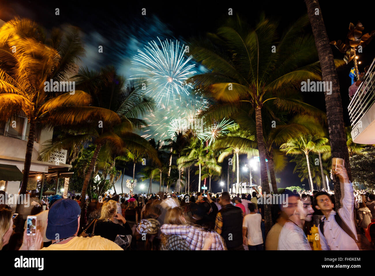 Miami Beach Florida,Ocean Drive,New Year's Eve fireworks,crowd,display sale palm trees,FL160101003 Stock Photo
