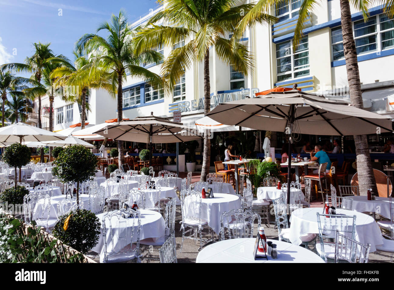 Miami Beach Florida,Ocean Drive,New Year's Day,hotel,lodging,hotels,restaurant restaurants food dining cafe cafes,al fresco sidewalk outside tables,ta Stock Photo