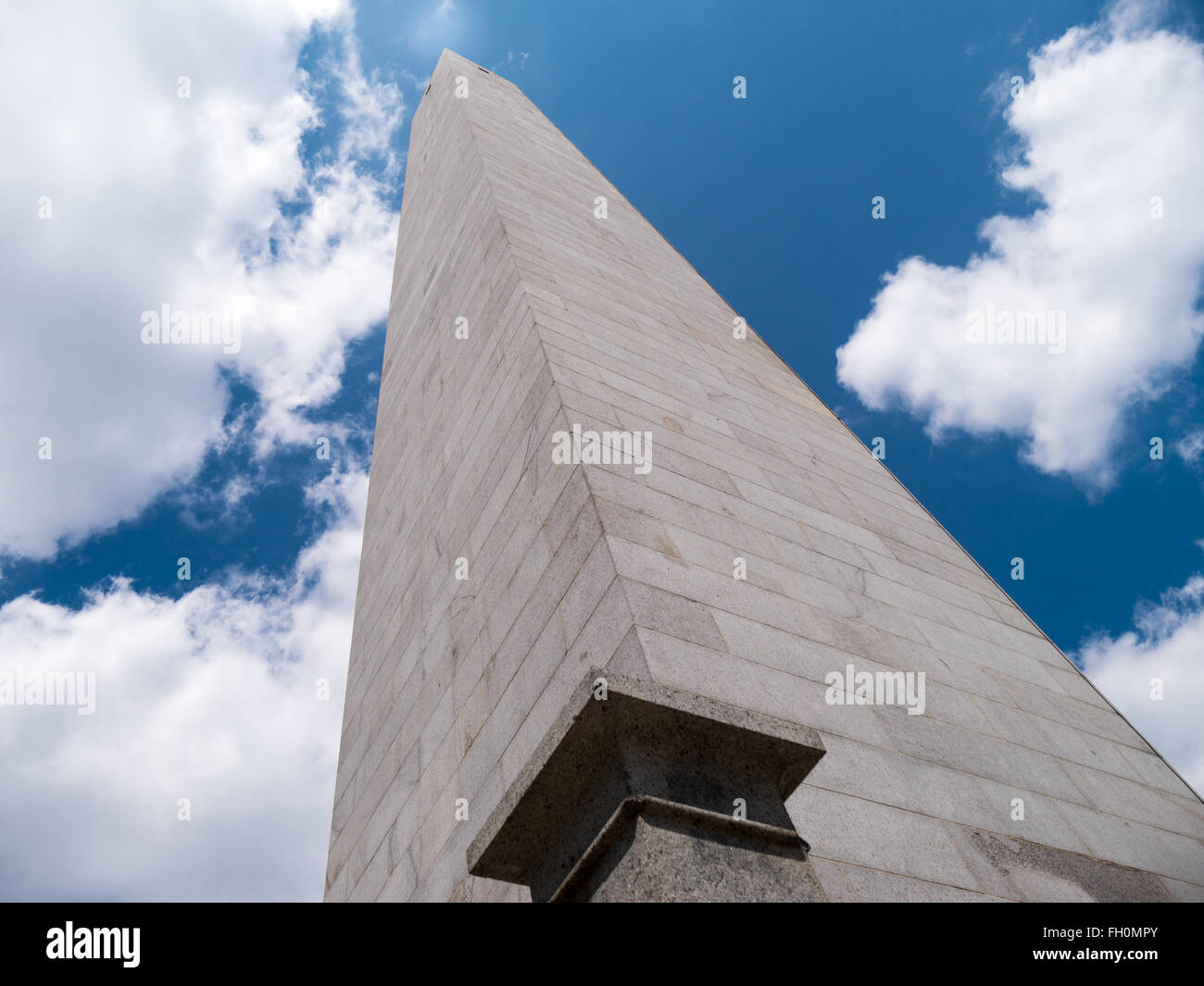 Bunker Hill Monument pointing towards a white reflection in the sky, a sign of hope and freedom Stock Photo