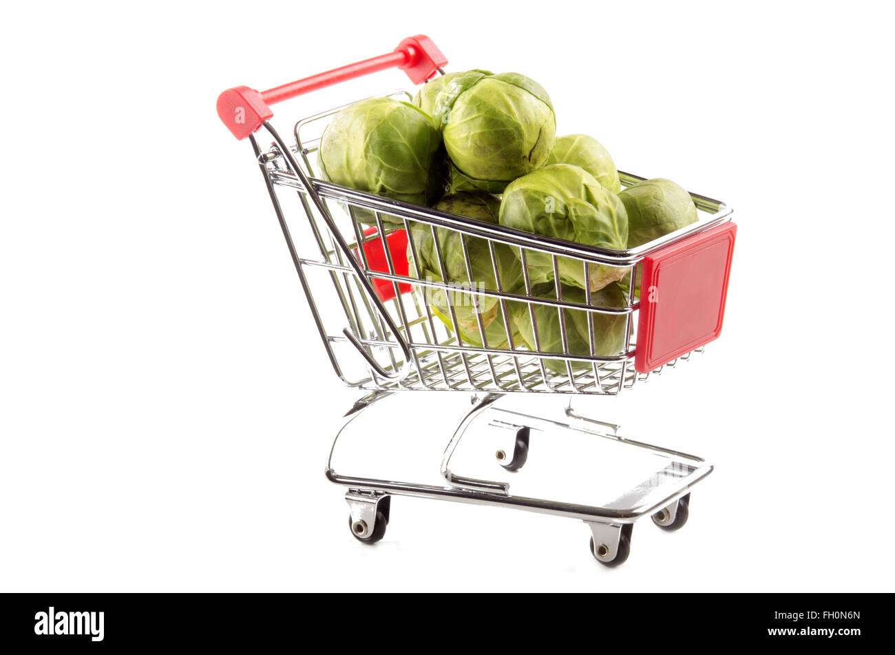organic brussels sprouts in a small shopping trolley Stock Photo