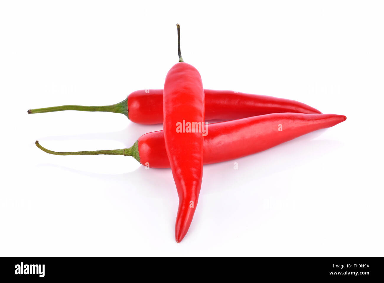 Red chilli peppers on white background Stock Photo