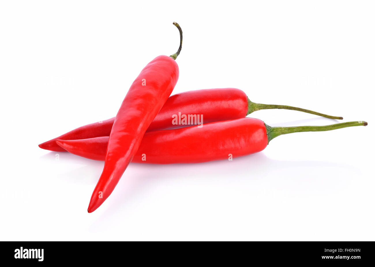 Red chilli peppers on white background Stock Photo