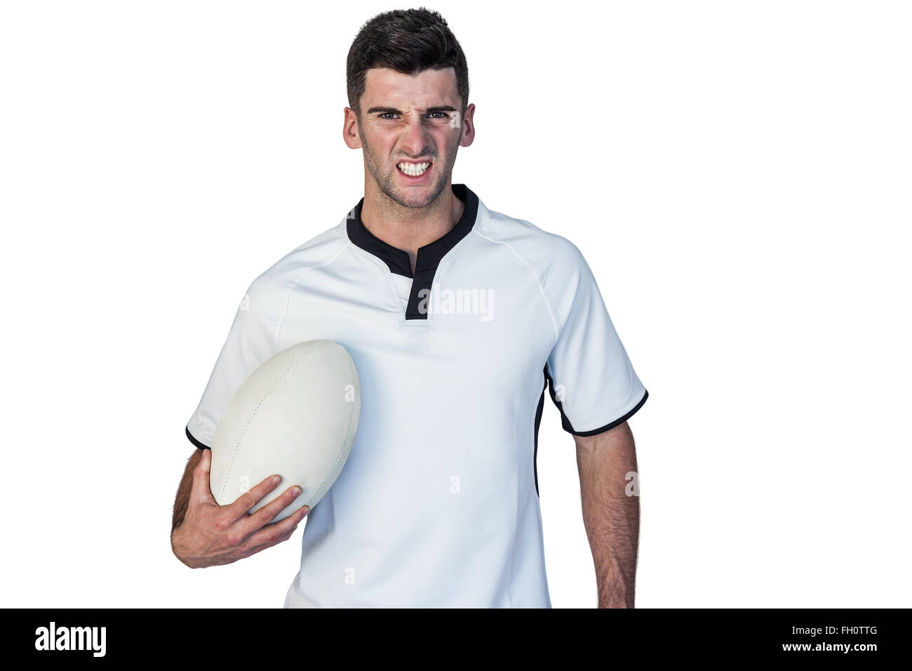 Portrait of an irritated rugby holding ball Stock Photo - Alamy