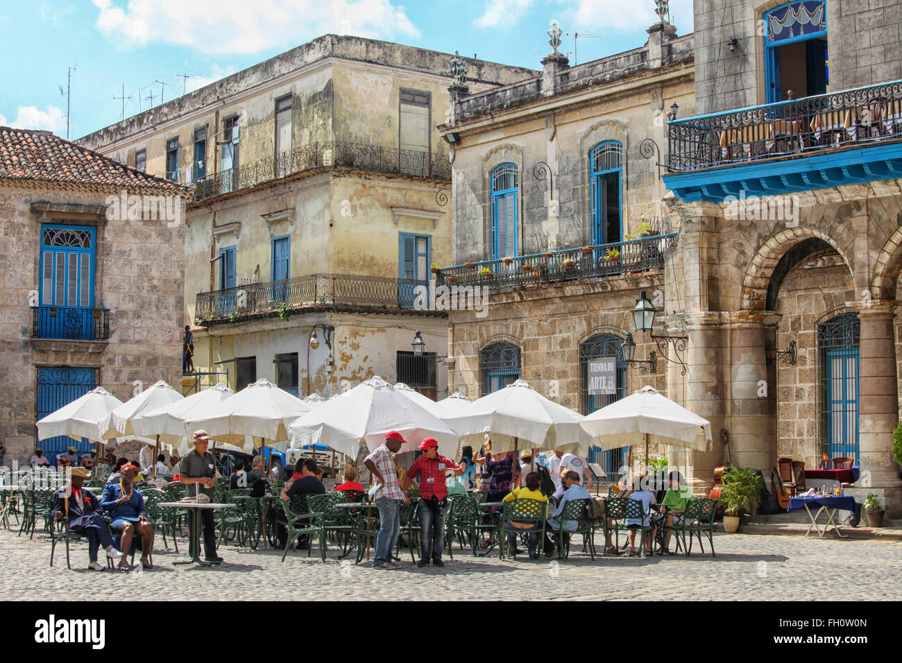 Tourists at a restaurant near the Havana Cathedral in Havana. Stock Photo