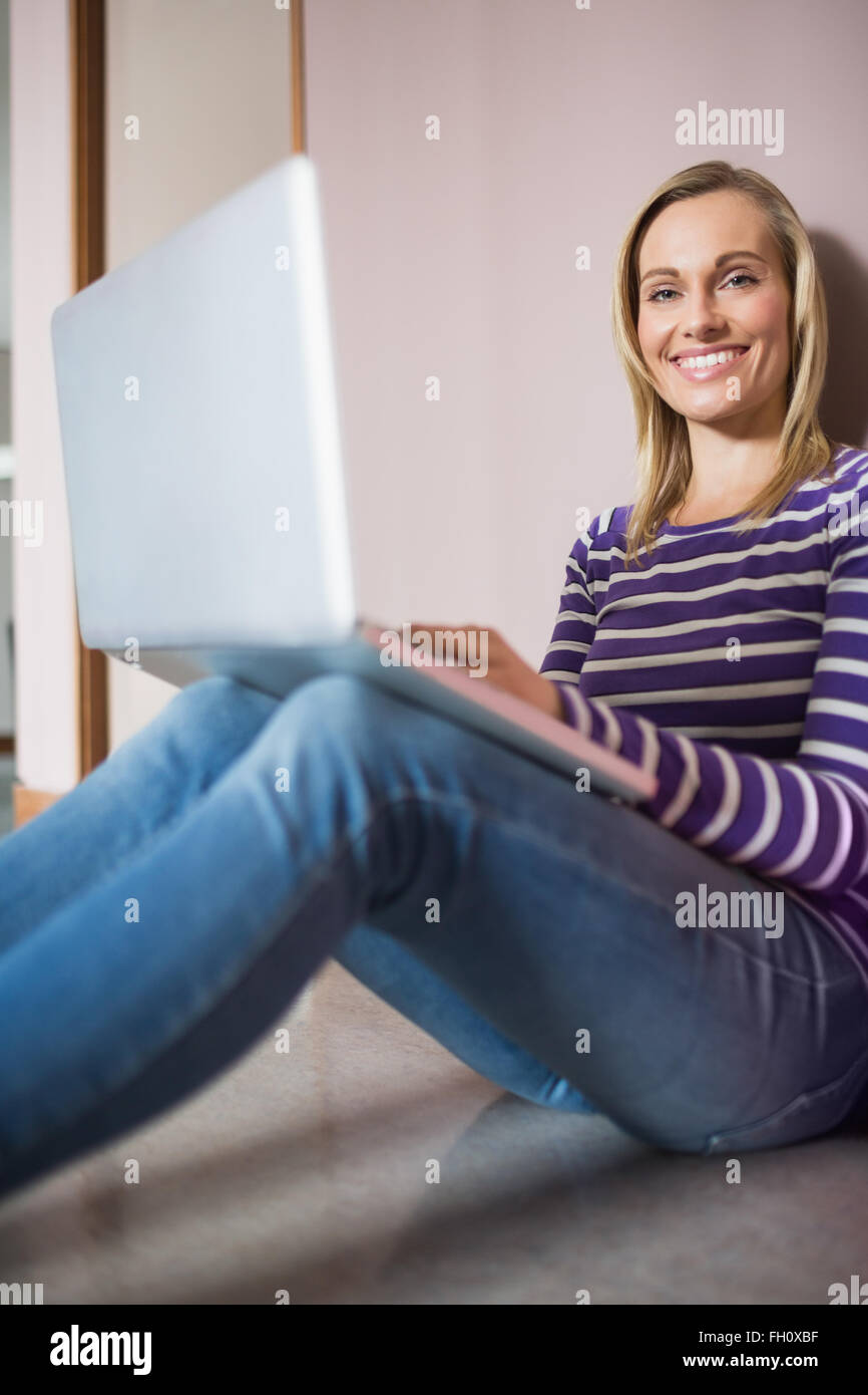 Portrait of happy female student using laptop Stock Photo - Alamy