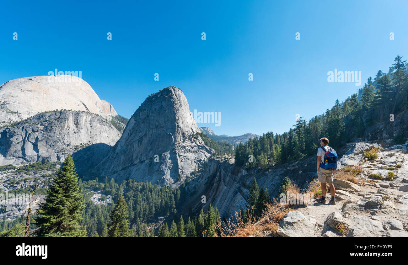 Walker looking on Liberty Cap, Yosemite National Park, California, USA, North America Stock Photo