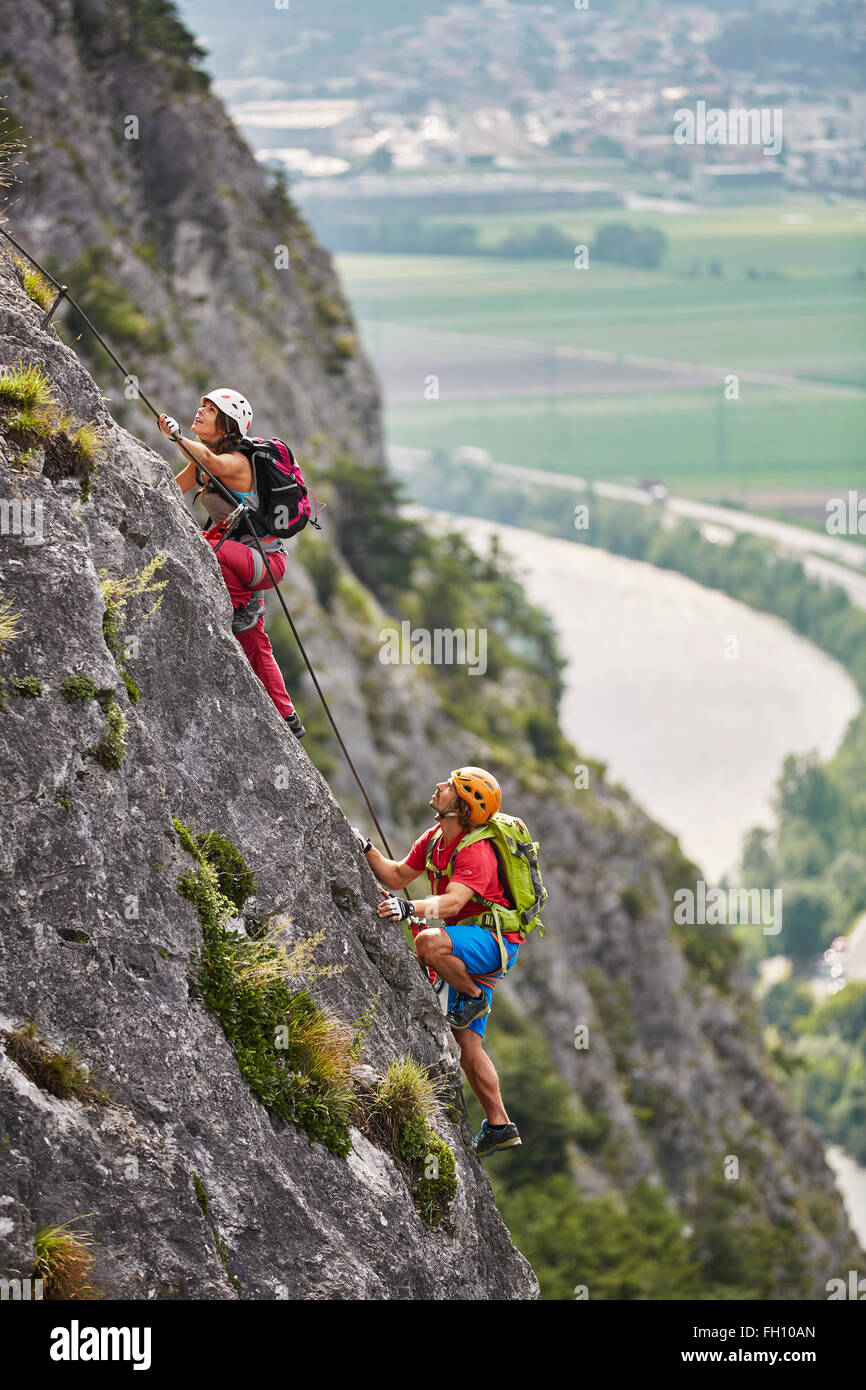 Mountaineers, climbers with helmet climbing the via ferrata, Zirl, Innsbruck, Tyrol, Austria Stock Photo