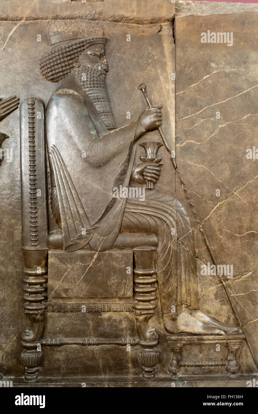 Ancient treasure house relief of the Achaemenids, audience relief of the Persian king Darius I, seated on the throne, Stock Photo