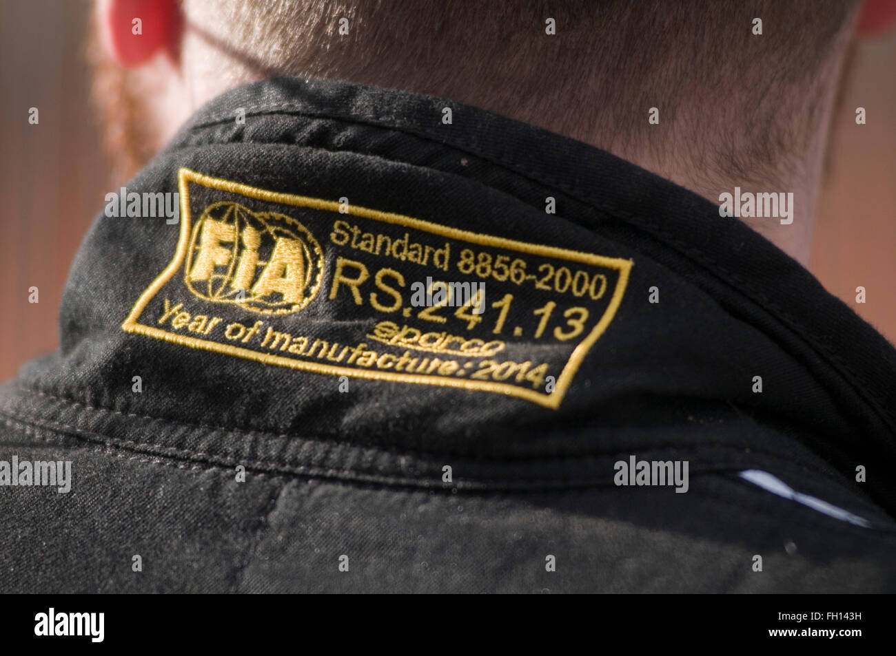 FIA approved fire suit being worn by racing driver safety standard standards fireproof proof overall overalls racing drivers sui Stock Photo