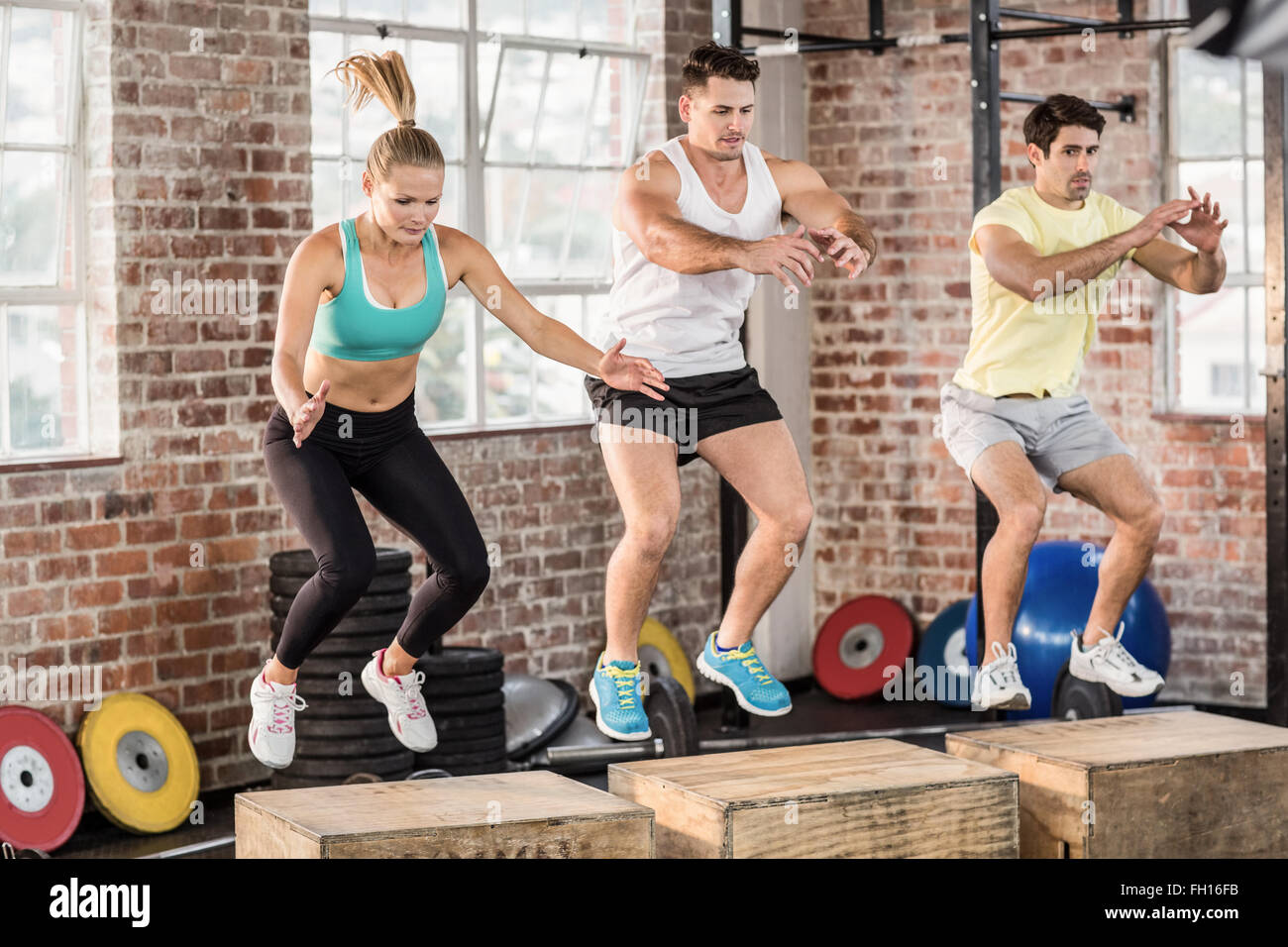 Fit people doing jump box Stock Photo