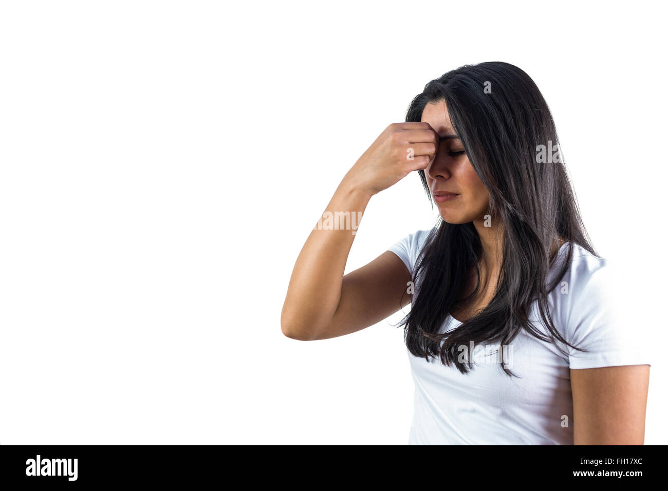 Woman pinching the bridge of her nose Stock Photo