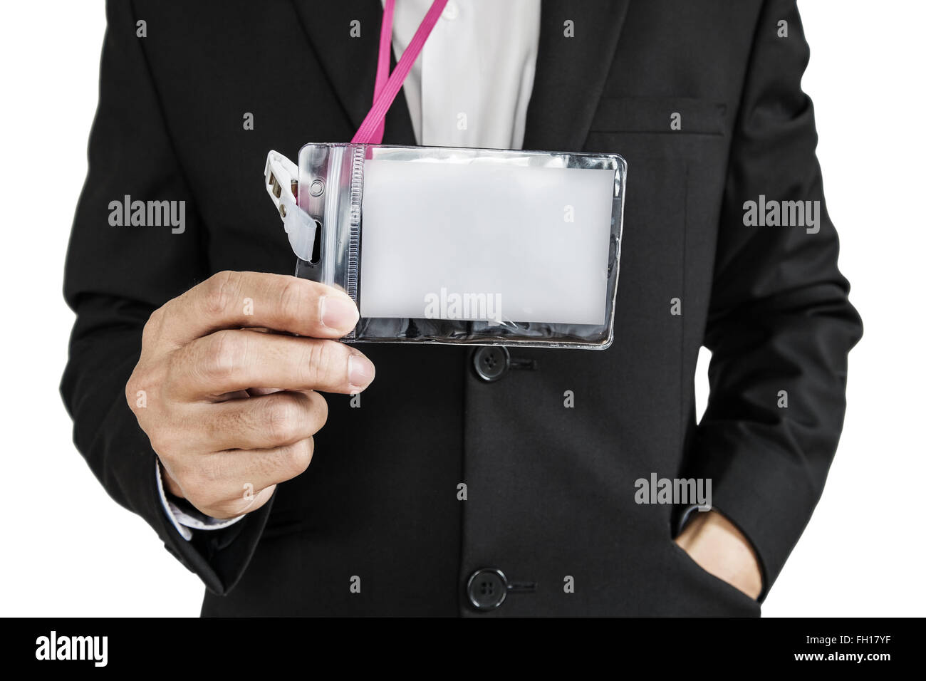 Employee in black suit showing ID card, isolated on white background Stock Photo