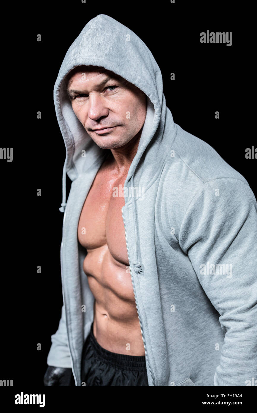 Portrait of muscular man in hood Stock Photo - Alamy